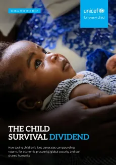 A mother holding her child during a breastfeeding and nutrition session.