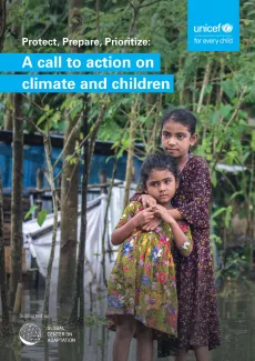 Two little girls in a flooded area