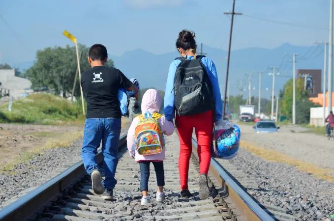 On 10 December 2014 outside of La Casa del Migrante, a catholic shelter that supports migrants near the Lecher&iacute;a Train Station, in the municipality of Tultitlan, State of Mexico, Maria [NAME CHANGED], 16 (on right), from Honduras travels north with her younger siblings, expecting to cross the border to the United States to reunite with her family.