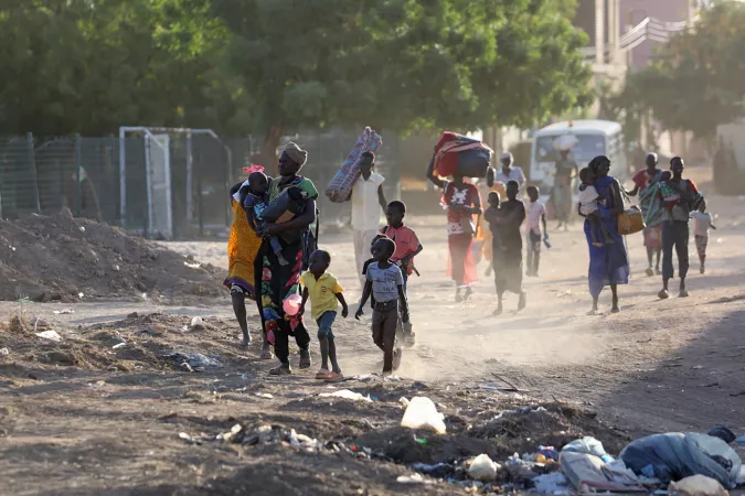 On 19 April 2023, children and families flee their neighbourhoods amid fighting in Khartoum, Sudan.