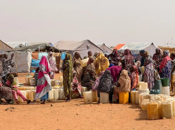 On 24 June, in Sudan, women and children displaced by the fighting in Al Obeid seek refuge in Tagat gathering at a shelter for the internally displaced. 