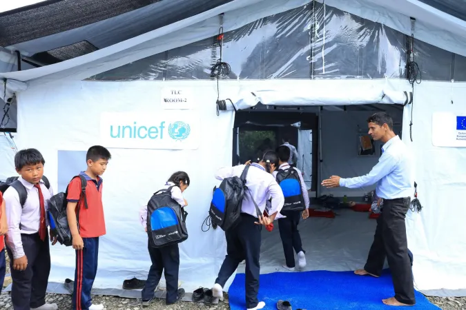 On 22 September 2026, at Tribhuvan Trishuli Secondary School in Nuwakot, Nepal, children return to learning in temporary learning centres or TLCs set up with UNICEF support after devastating floods damaged classrooms and disrupted education in affected communities. The centres provide safe learning spaces with inclusive WASH facilities, helping children regain a sense of routine, stability and hope after weeks of loss and uncertainty.