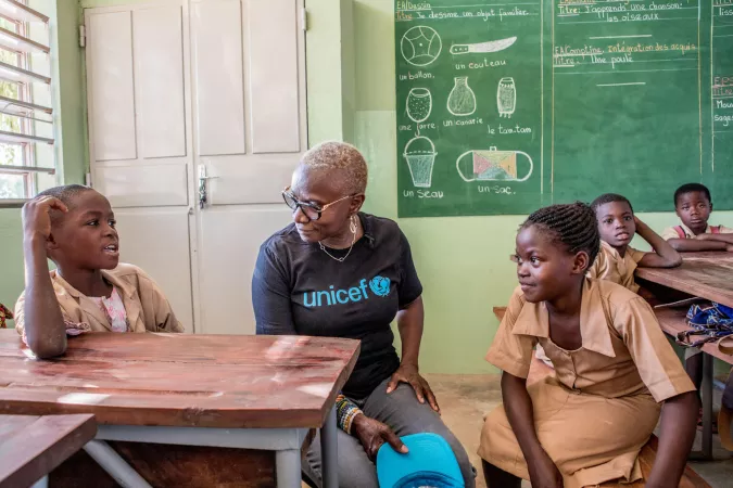 UNICEF Goodwill Ambassador Ang&eacute;lique Kidjo speaks with children while visiting the Tchoutchoubou primary school in Tangui&eacute;ta, Benin. 