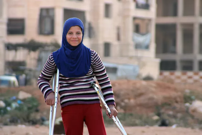 A girl on crutches, Syria