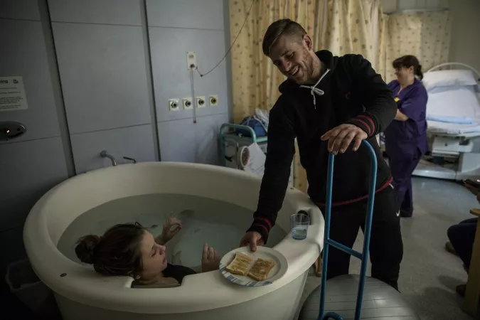 Damien Armes gives his wife Tamzin a piece of toast while she&rsquo;s in labour in a birthing pool, in the maternity ward of the Royal Devon and Exeter Hospital, in Exeter, Devon, England, 28 February 2018.