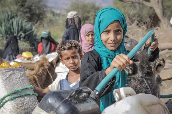 Children, filing water at the water distribution points fetching clean water supported by UNICEF in Al-Dhalie governorate.