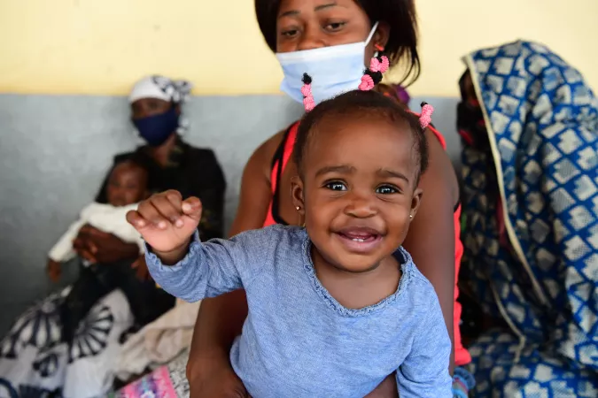 Vaccines for all: A mother brings her baby to a hospital in Cameroon for her vaccinations.