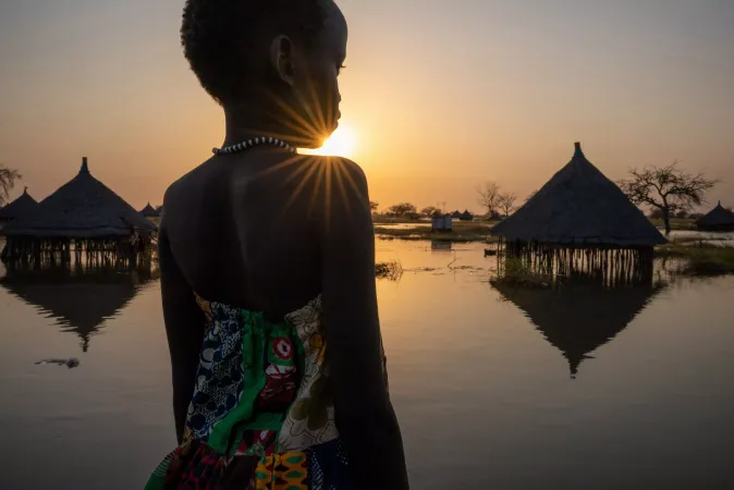 A girl looks out over submerged houses in Panyagor in Twic East, Jonglei State in South Sudan. 