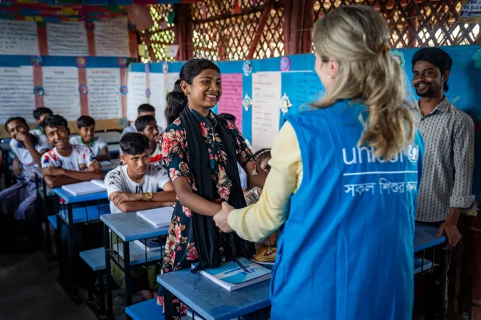 On 8 October 2025, at the Rohingya Refugee Camp in Cox&rsquo;s Bazar, Bangladesh, UNICEF Private Fundraising and Partnerships Division Director, Carla Haddad Mardini, talks with a UNICEF staff member and community members at a tap stand.