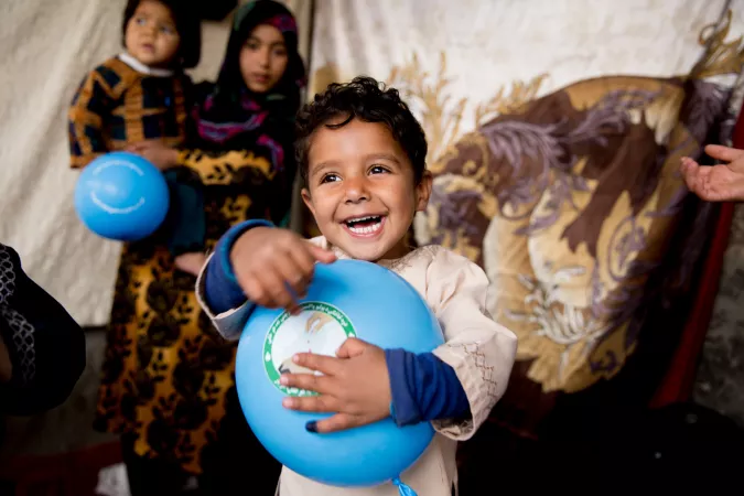 In southern Afghanistan, a boy is vaccinated against polio. 