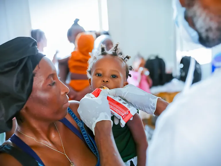 mother holding cihld