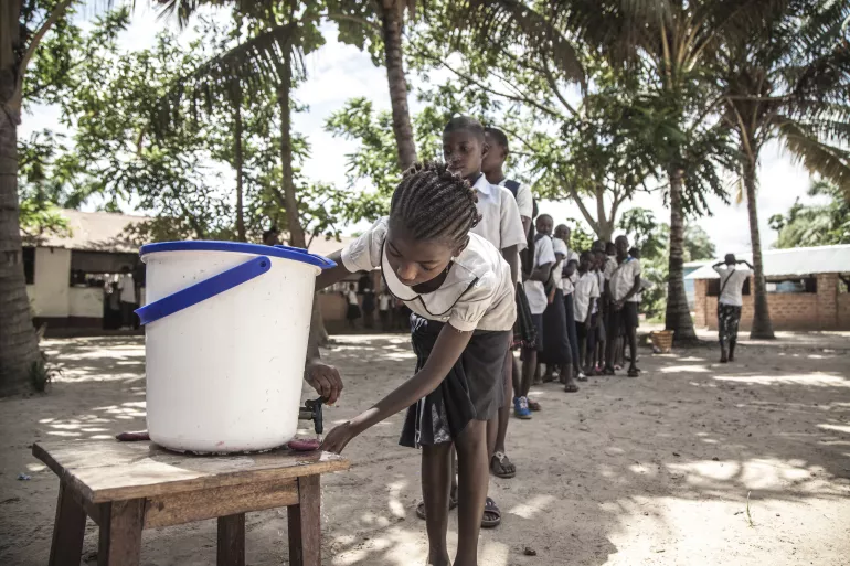 On 22 May 2018, children wash their hands to help contain the Ebola outbreak before entering a classroom in the north-western city of Mbandaka, in the Democratic Republic of the Congo. UNICEF has installed hand-washing points in 50 targeted schools in affected areas in the port city.