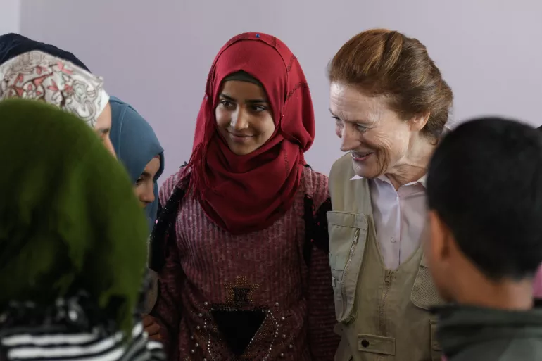 On 3 March 2020 in the Syrian Arab Republic, UNICEF Executive Director Henrietta H. Fore (second from right) speaks with students Tal-Amara school in southern rural Idlib. The school is the only elementary school in Tal-Amara village. With support from UNICEF, the school is providing 130 children with formal education and an accelerated learning programme (Curriculum B) for children who have missed out on years of education. The school is also part of the World Food Programme's School Feeding Programme in t