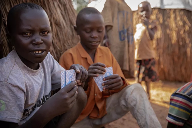 Children sit in Linzi IDP camp 1, Djugu territory, Ituri Province, Democratic Republic of the Congo, in February 2020