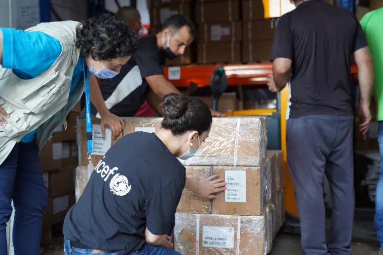 On 6 August 2020, UNICEF employees engage in the safe transfer of vaccines from a damaged warehouse of the Ministry of Public Health, located in the port area of Beirut, Lebanon. Two days prior, the warehouse, along with numerous other buildings, was damaged by an enormous explosion that took over 150 lives and left hundreds of thousands of people homeless. Despite the explosion and ongoing COVID-19 pandemic, vaccines remain available for children in Lebanon.