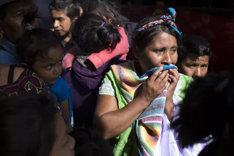 A mother cries in anticipation of meeting her son, who had been deported from Mexico, at the governmental reception shelter "Nuestras Raices" ("Our Roots", in English) in Quetzaltenango, Guatemala on May 3, 2018. All minors deported from Mexico are sent to this center by bus.
