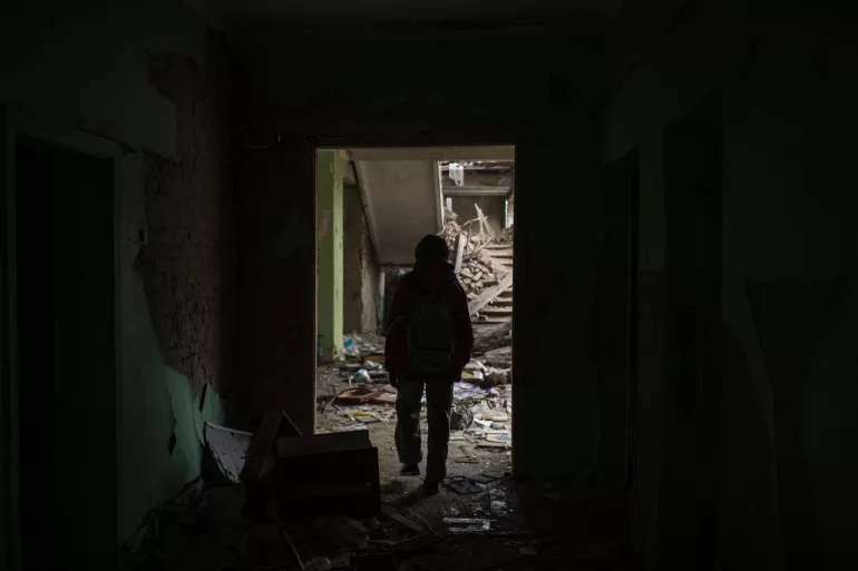 On 27 September 2022 in Chernihiv, Ukraine, Darya Nikolayenko, 14, walks through rubble in School #21, which was destroyed by bombing on 3 March. 
