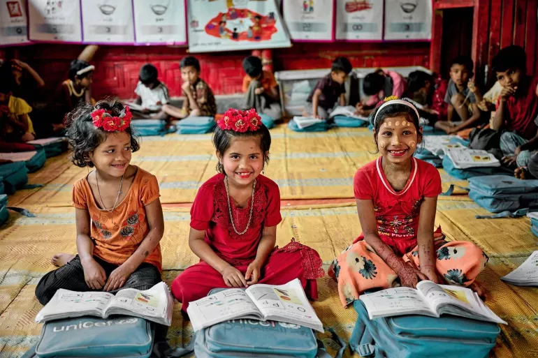 3 Rohingya girls inside the Mukti learning center. Pahartoli-1/2, Camp-4, Ukhia, Coxs Bazar, Bangladesh.