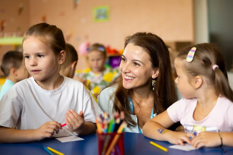 UNICEF Regional Director for Europe and Central Asia, Regina De Dominicis, speaks with preschool children during her visit to "Lisova Pisnya" - one of the kindergarten in Irpin Municipality, supported by UNICEF. 21 August 2023
