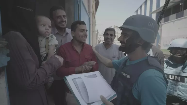 UNICEF Communication Officer Salim Oweis with a family in Gaza