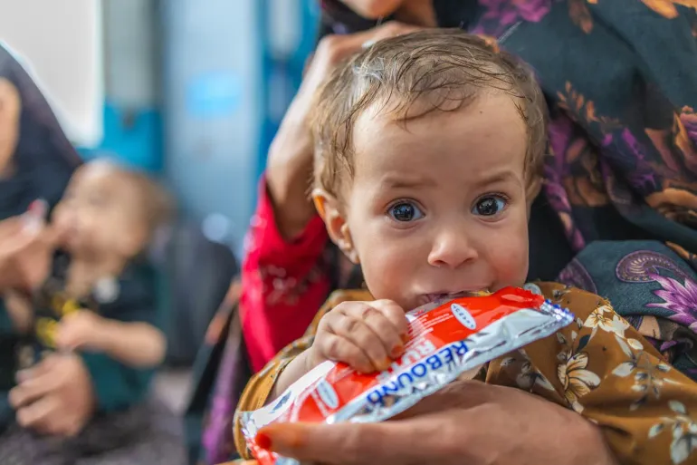 Zainab, a 1-year-old girl, attends a follow-up nutrition visit at Hawz Karbas Basic Health Clinic. 2026