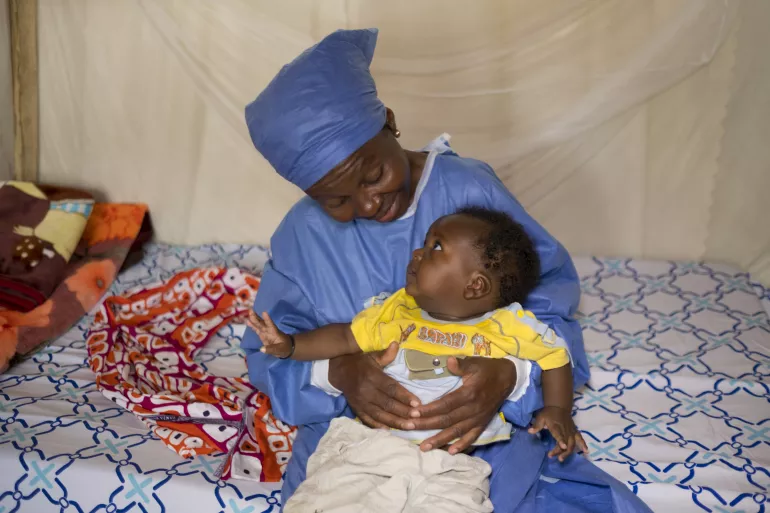 Democratic republic of the Congo. A woman holds a baby.