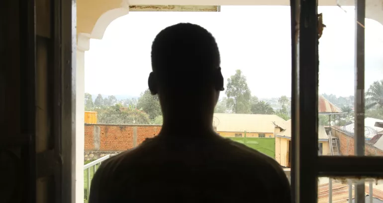 Democratic Republic of the Congo. A child looks out of a window at a care centre in Bunia.