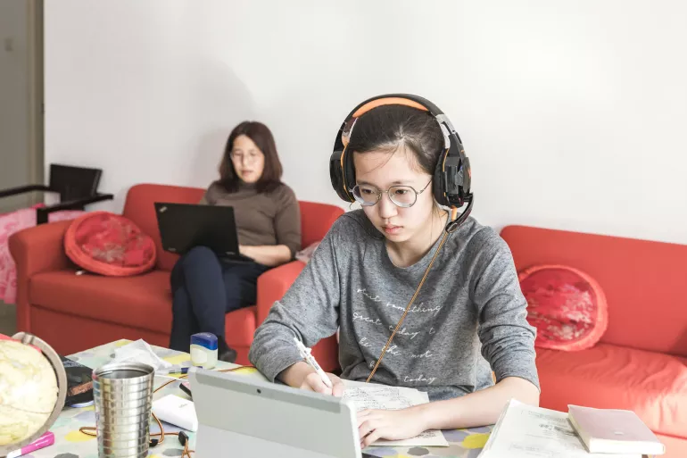 In Beijing, China, Xiaoyu studies at home while her mother also works remotely 