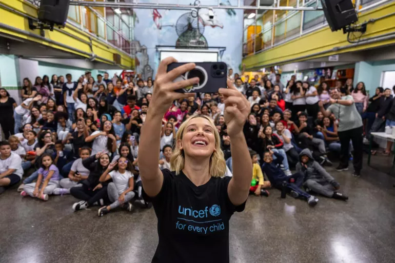 UNICEF Goodwill Ambassador Millie Bobby Brown takes a selfie with the students at a school in S&atilde;o Paulo, Brazil