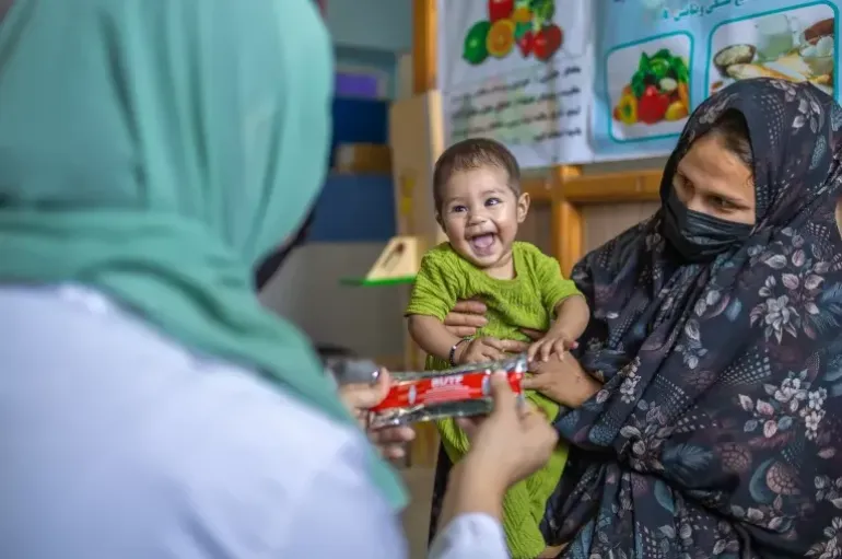 woman holding child