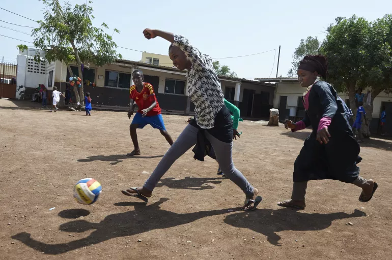 Children play football