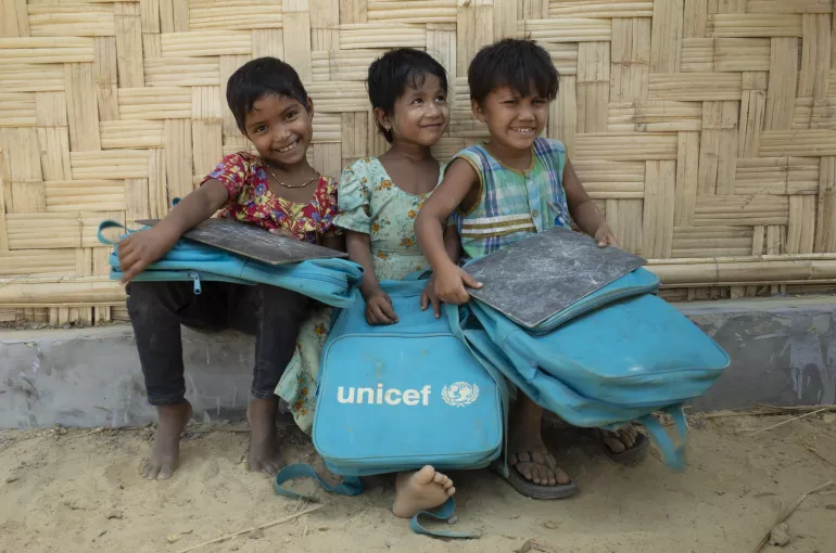 Bangladesh. Rohingya girls sit outside a UNICFE-supported learning centre.