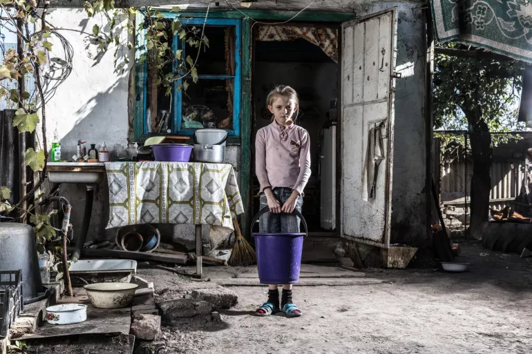 Due to conflict in eastern Ukraine, nine-year-old Sasha has never had running water at her home. Instead, she must collect water from the river.