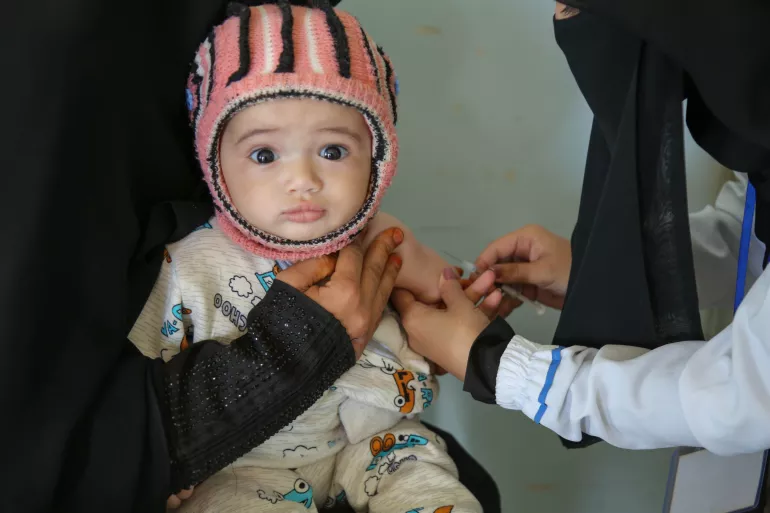 Yemen. A child is vaccinated during a measles and rubella vaccination campaign.