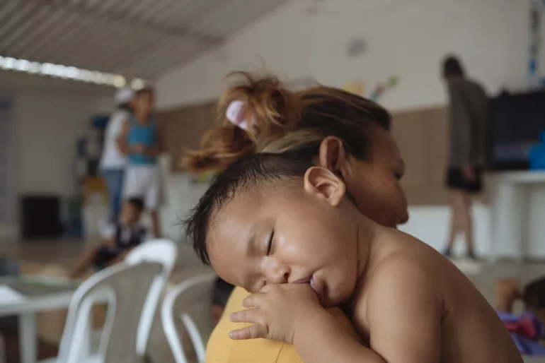 Baby with mother at child friendly space in Cucuta