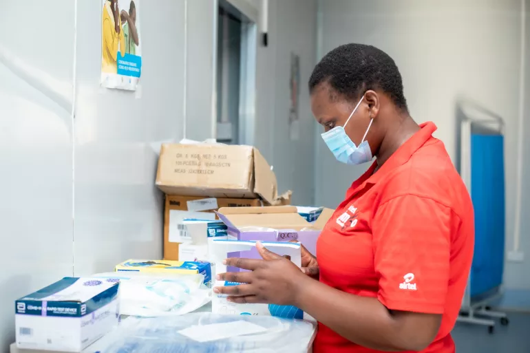 Malawi. A nurse sorts through supplies at an emergency treatment unit.