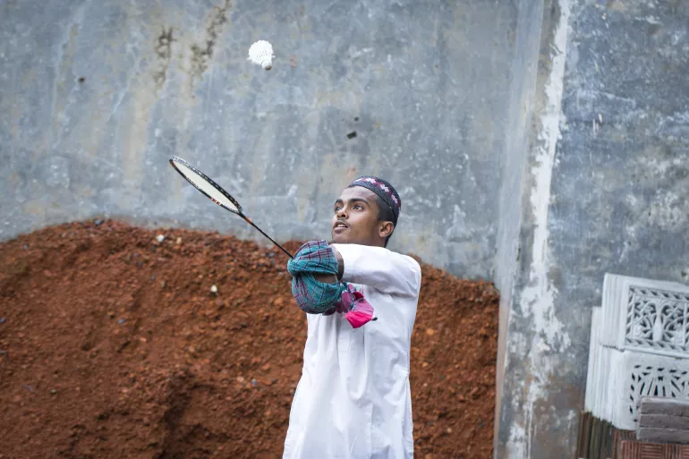Omar loves playing badminton in front of his house at Ahmedpur Union, Char Fasson, Bhola on 27 October 2021.