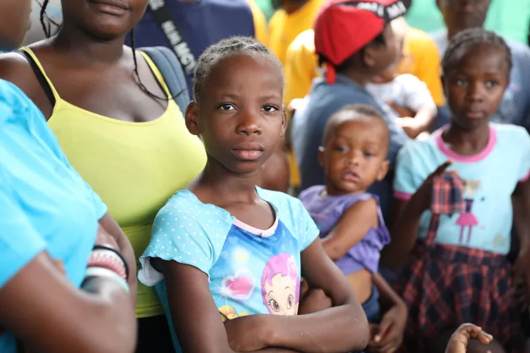 Haiti. Families gather at a site for displaced persons in Tabarre
