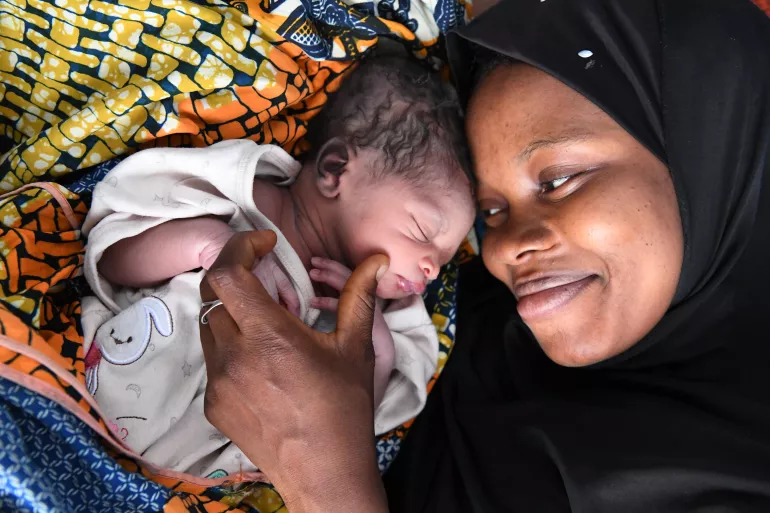 New mother Animata cuddles her newborn baby at the PMI health center of Odienn&eacute;, Northeast of C&ocirc;te d'Ivoire.