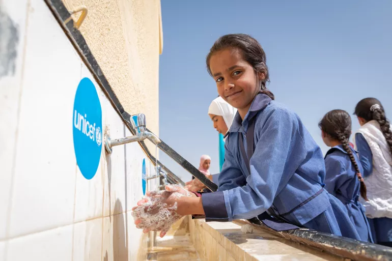 Jordan. A girl washes her hands.