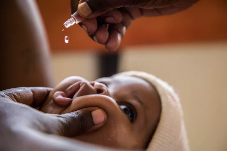 Baby Najib gets polio drops in a health centre in Uganda in April 2020. To support the continuity of such immunization services, UNICEF procured 3,842,000 doses of bivalent oral polio vaccine (bOPV). The vaccines, funded by the Government, arrived in the country on 24 April 2020. 