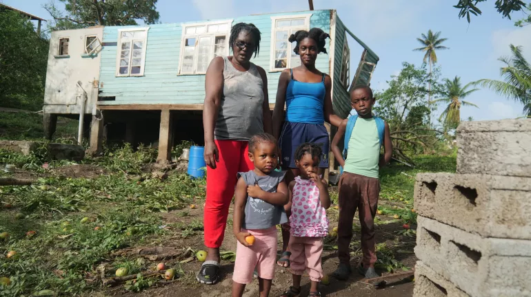 Naomi Noel (in blue) just returned to their damaged home with her mother, two children and neice on July 1 2024