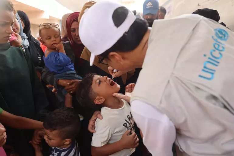A child receives a polio vaccine at a health clinic in Khan Younis, southern Gaz Strip.