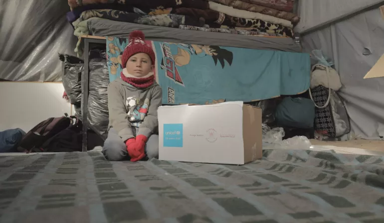 UNICEF and partners bring warm clothes in Khan Yunis by distributing jackets, pants, sweatshirts and other winter gear to children in Al Fajer Camp, in Khan Yunis, South Gaza.