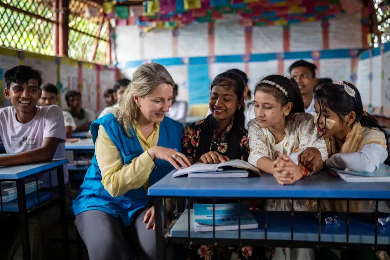 On 8 October 2025, at the Rohingya Refugee Camp in Cox&rsquo;s Bazar, Bangladesh, UNICEF Private Fundraising and Partnerships Division Director, Carla Haddad Mardini, talks with young students during a visit to the Learning Centre.