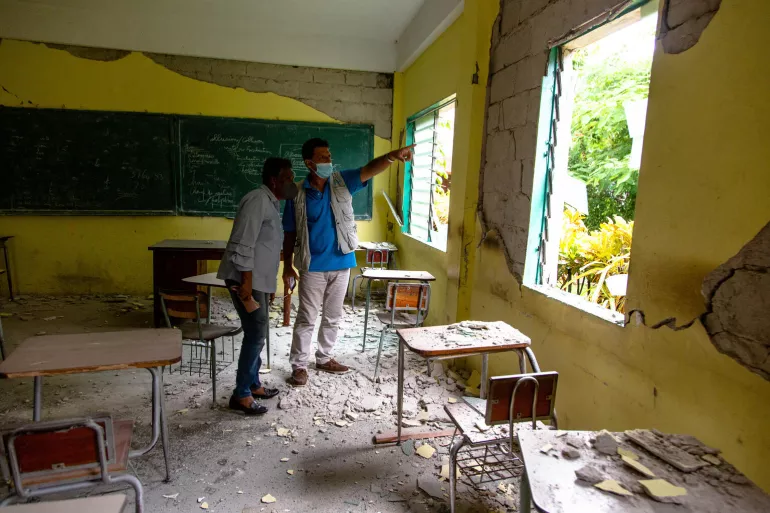 UNICEF Representative in Haiti Bruno Maes and Minister of Education Marie Lucie Joseph tour and assess damage to College Mazenod in Camp-Perrin, Les Cayes, Haiti.