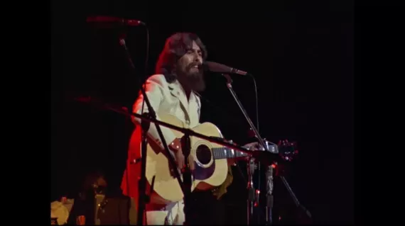 Man playing guitar and singing 