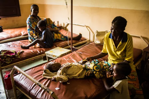 A woman takes care of her grandson who is receiving treatment for malnutrition in Democratic Republic of the Congo, DRC