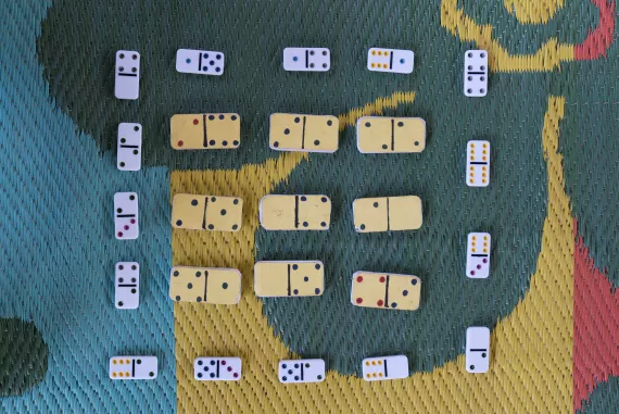 real dominoes aligned with homemade dominoes
