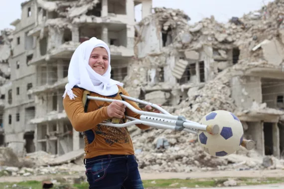 Saja, 13, plays with her football.